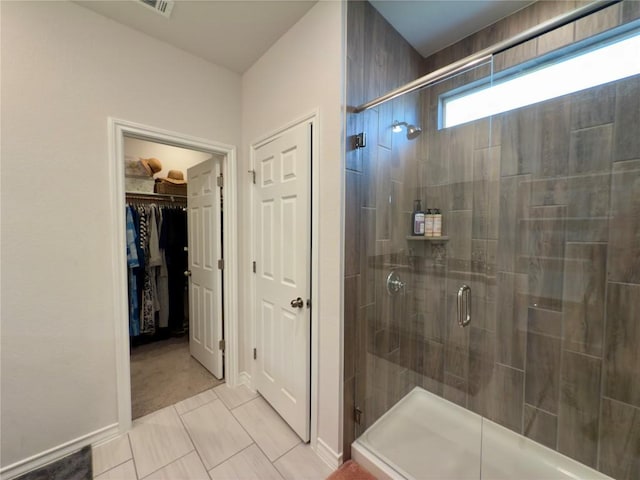 171 Longstraw Dr, Buda, TX 78610 - bathroom with a shower stall and a walk in closet