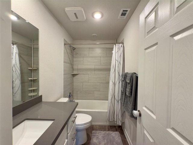 171 Longstraw Dr, Buda, TX 78610 - bathroom featuring vanity, shower / tub combo with curtain, toilet, wood finished floors, and recessed lighting