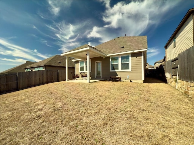 171 Longstraw Dr, Buda, TX 78610 - back of property featuring a patio area and a fenced backyard