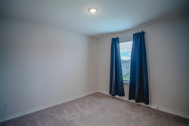 171 Longstraw Dr, Buda, TX 78610 - carpeted empty room featuring baseboards