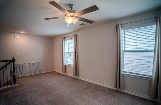 171 Longstraw Dr, Buda, TX 78610 - empty room with healthy amount of natural light, ceiling fan, carpet floors, and baseboards