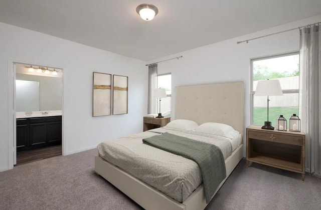 carpeted bedroom featuring ensuite bathroom, a sink, and baseboards