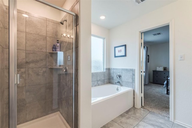 bathroom with visible vents, a stall shower, tile patterned flooring, and a bath