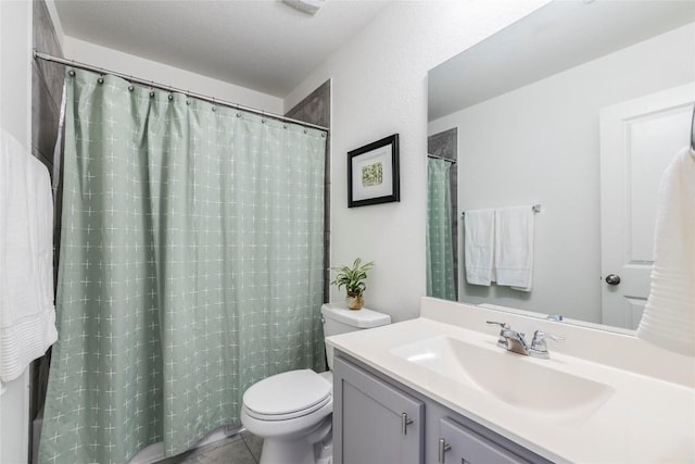 bathroom featuring tile patterned floors, vanity, toilet, and a shower with curtain