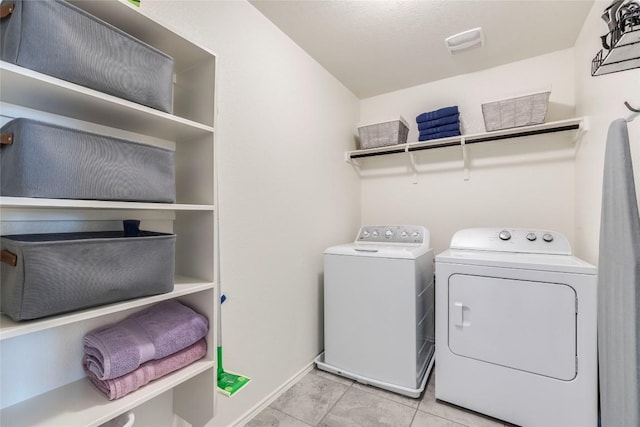 laundry room featuring laundry area, tile patterned floors, visible vents, and independent washer and dryer