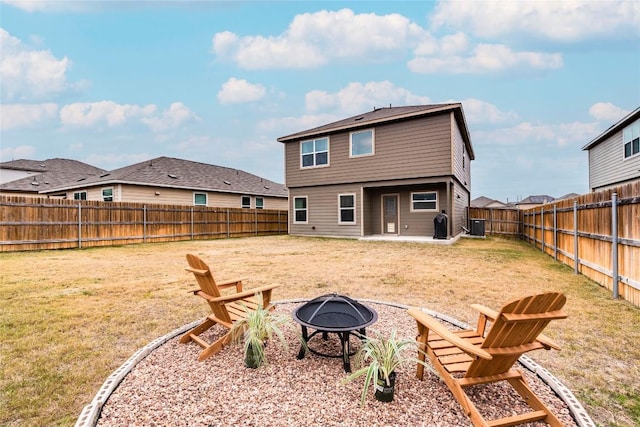 back of property featuring an outdoor fire pit, a fenced backyard, central air condition unit, a lawn, and a patio area