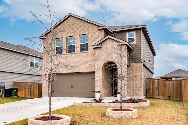 traditional-style home with brick siding, fence, driveway, and a front lawn