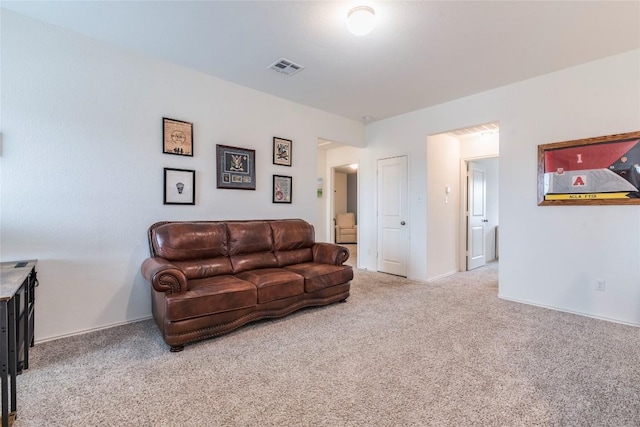 living room with visible vents and light colored carpet