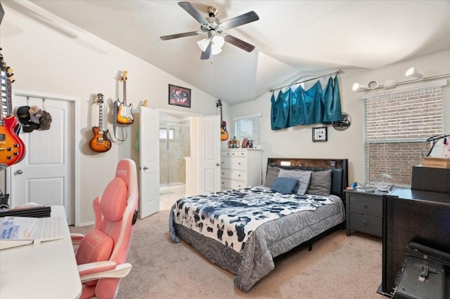 bedroom with ensuite bath, carpet, vaulted ceiling, and a ceiling fan