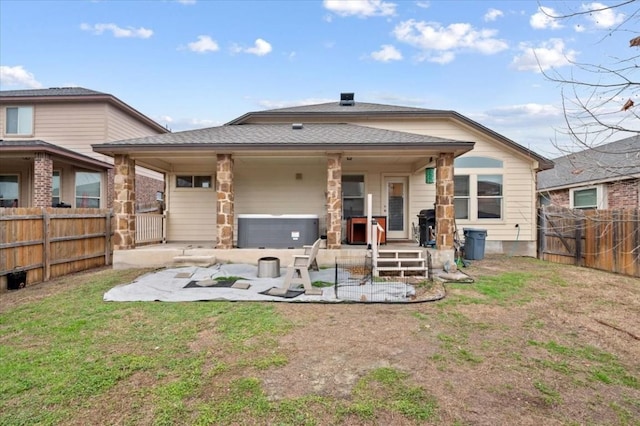 rear view of house featuring a patio area, a yard, a fenced backyard, and central air condition unit