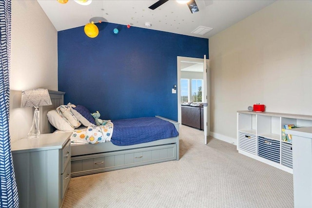 bedroom featuring carpet, visible vents, a ceiling fan, vaulted ceiling, and baseboards