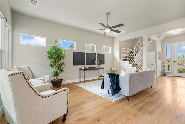 3011 Chisholm Trl, Austin, TX 78734 - living area featuring stairs, a ceiling fan, and light wood-style flooring