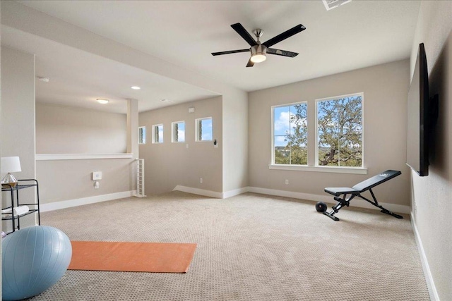 exercise area featuring carpet, ceiling fan, baseboards, and recessed lighting