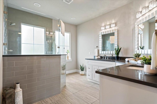 3011 Chisholm Trl, Austin, TX 78734 - bathroom featuring vanity, a walk in shower, and tile patterned floors