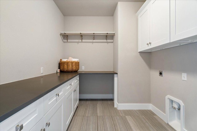 3011 Chisholm Trl, Austin, TX 78734 - laundry area with electric dryer hookup and cabinet space