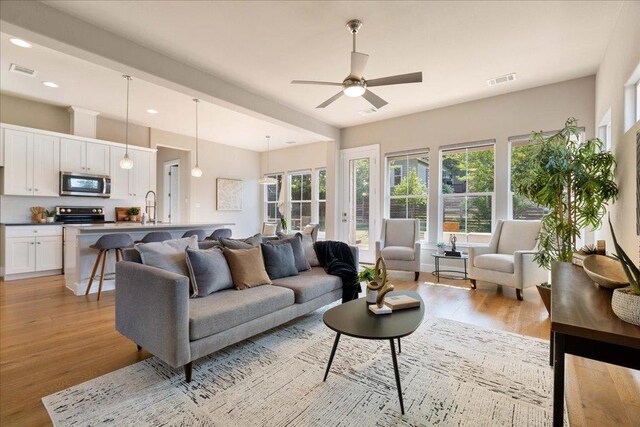 3011 Chisholm Trl, Austin, TX 78734 - living room with light wood-style flooring, ceiling fan, and recessed lighting