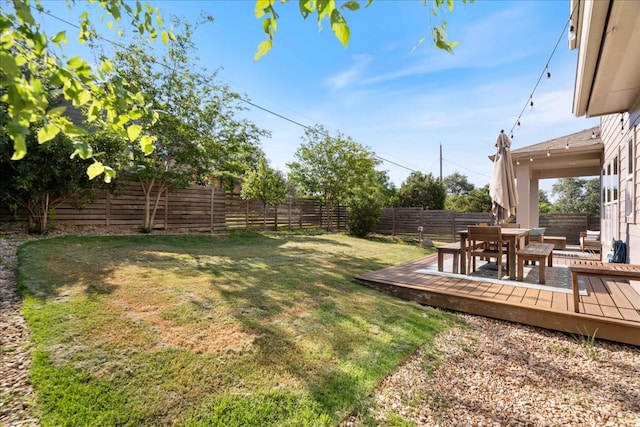 3011 Chisholm Trl, Austin, TX 78734 - fenced backyard featuring a wooden deck and outdoor dining area