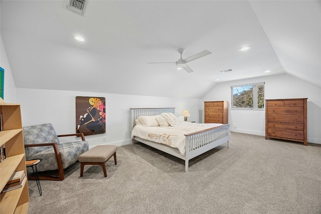 carpeted bedroom featuring ceiling fan, visible vents, vaulted ceiling, and baseboards