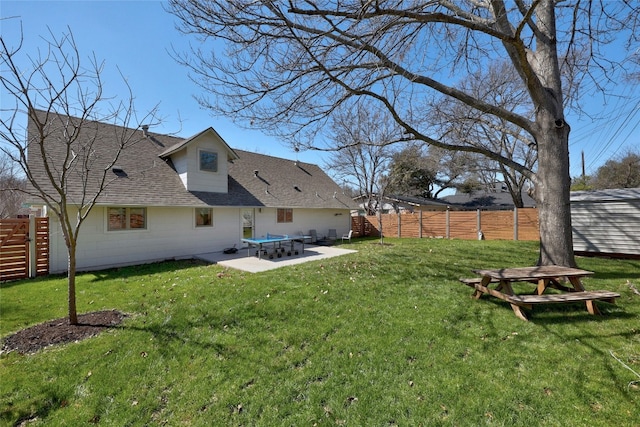 view of yard featuring fence and a patio