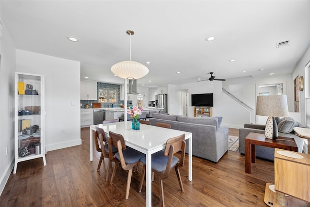 dining area with baseboards, visible vents, dark wood-style flooring, and recessed lighting