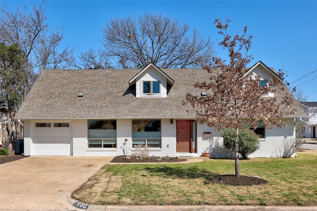 view of front of house featuring concrete driveway, brick siding, roof with shingles, and a front yard