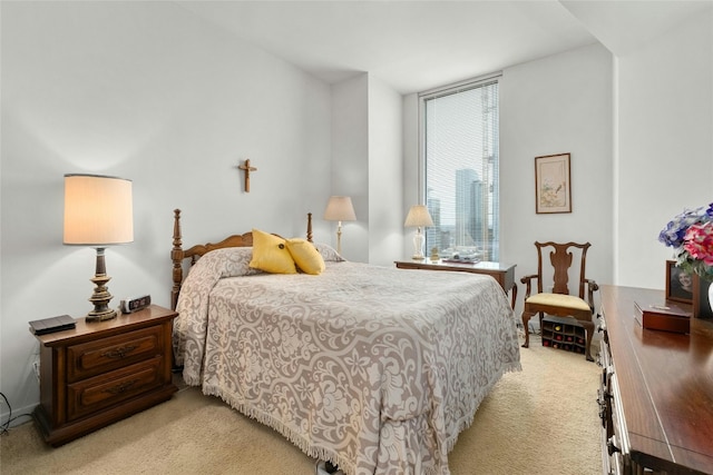 bedroom featuring light colored carpet