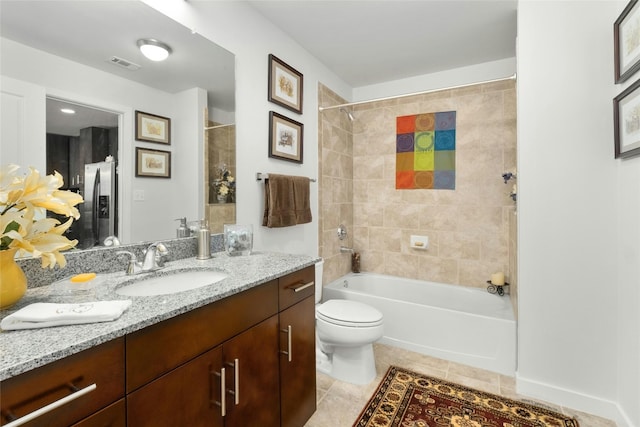 bathroom featuring shower / bath combination, visible vents, toilet, tile patterned flooring, and vanity