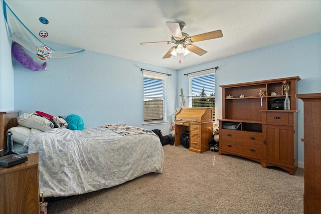 bedroom featuring a ceiling fan and light carpet