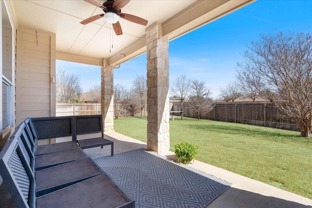 view of patio with outdoor lounge area, a fenced backyard, and a ceiling fan