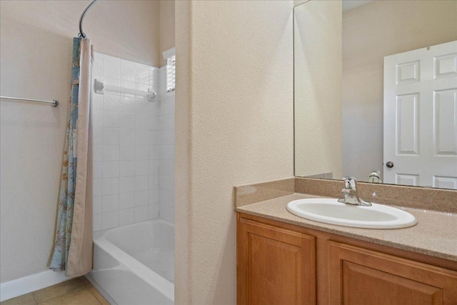 full bath with tile patterned flooring, shower / bathtub combination with curtain, and vanity