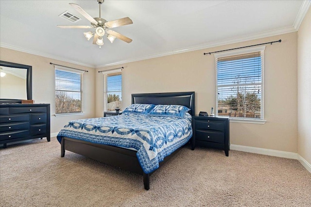 carpeted bedroom featuring a ceiling fan, baseboards, visible vents, and crown molding