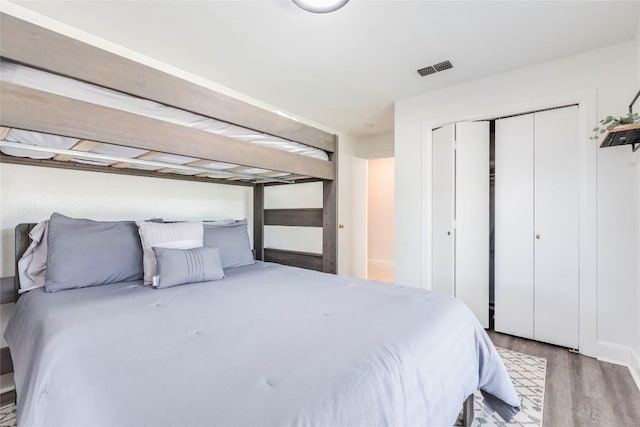 13113 Mansfield Dr, Austin, TX 78732 - bedroom with wood finished floors and a closet