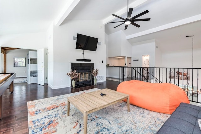 13113 Mansfield Dr, Austin, TX 78732 - living area with ceiling fan, beamed ceiling, high vaulted ceiling, wood finished floors, and a fireplace