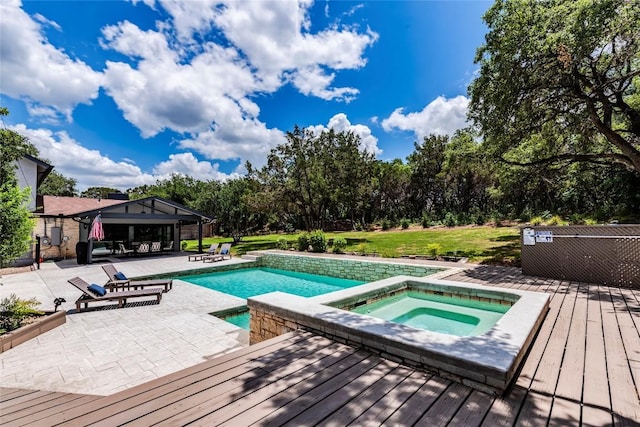 pool featuring a yard, a gazebo, a patio area, an in ground hot tub, and a wooden deck