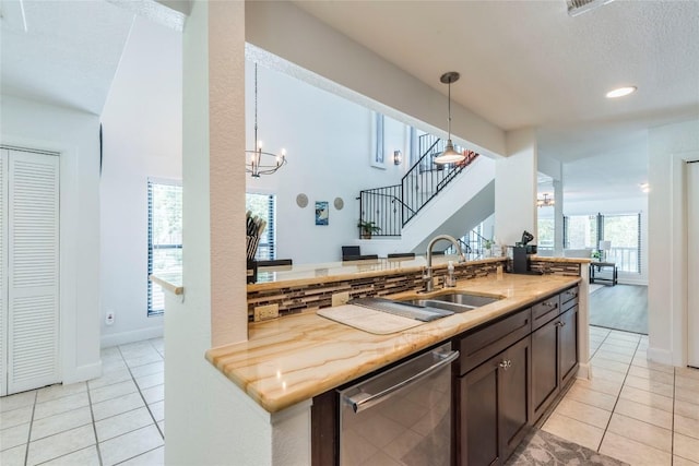 13113 Mansfield Dr, Austin, TX 78732 - kitchen featuring dishwasher, light tile patterned floors, pendant lighting, a chandelier, and recessed lighting