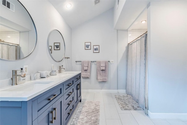 13113 Mansfield Dr, Austin, TX 78732 - full bathroom with double vanity, lofted ceiling, a shower with shower curtain, and recessed lighting