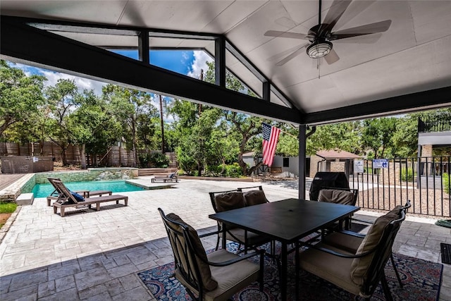 view of patio with outdoor dining space, a fenced backyard, a ceiling fan, and a fenced in pool