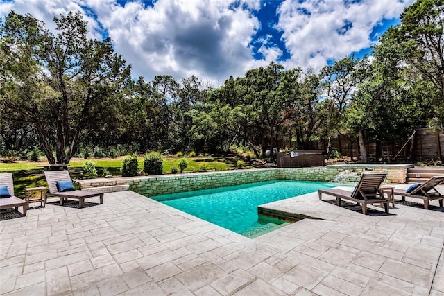 13113 Mansfield Dr, Austin, TX 78732 - outdoor pool featuring a hot tub, a patio, and view of wooded area
