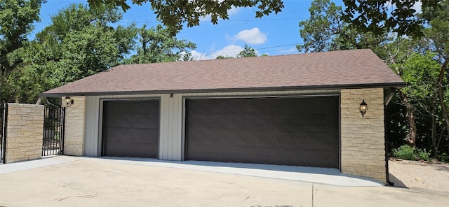 detached garage with a gate