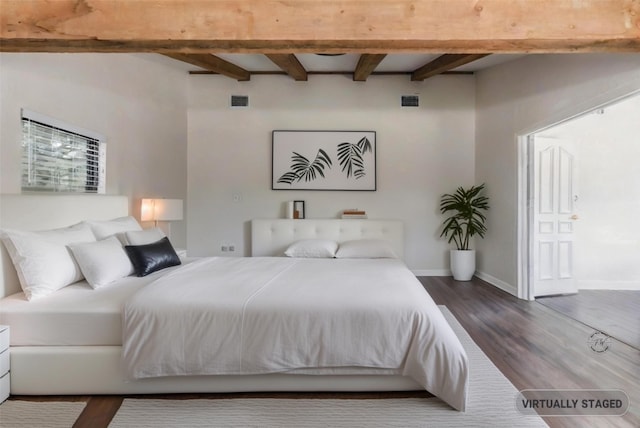 bedroom with beam ceiling, dark wood-style flooring, visible vents, and baseboards