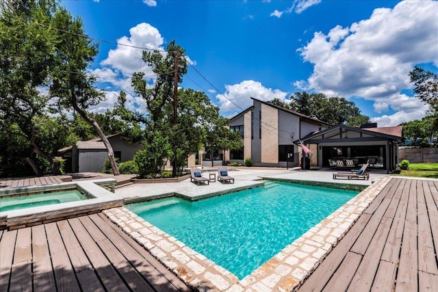 13113 Mansfield Dr, Austin, TX 78732 - swimming pool with an in-ground hot tub, a patio area, an outdoor structure, and a storage unit