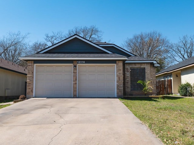 ranch-style home featuring concrete driveway, an attached garage, fence, and a front yard