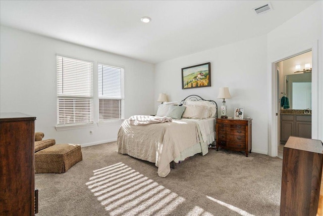 185 Slenderleaf Dr, Marble Falls, TX 78654 - carpeted bedroom with baseboards and ensuite bathroom