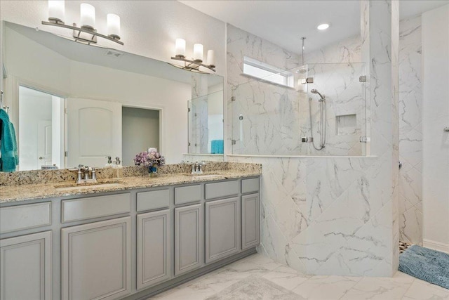 185 Slenderleaf Dr, Marble Falls, TX 78654 - full bath featuring marble look tile flooring, a marble finish shower, and double vanity