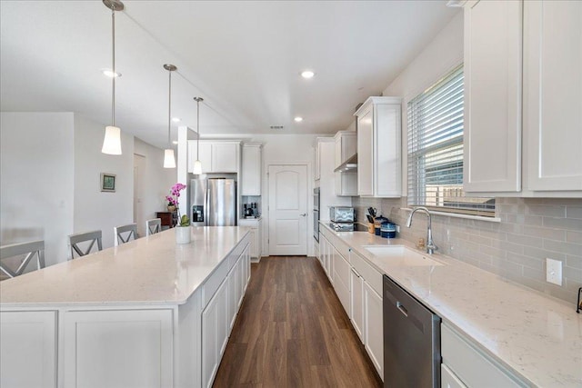 185 Slenderleaf Dr, Marble Falls, TX 78654 - kitchen featuring a sink, appliances with stainless steel finishes, dark wood-type flooring, white cabinetry, and tasteful backsplash