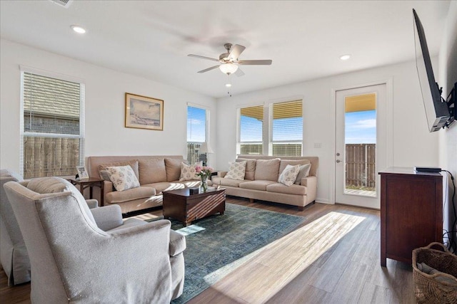 living area with recessed lighting, ceiling fan, and wood finished floors