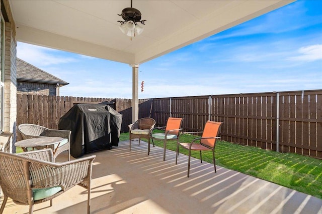 185 Slenderleaf Dr, Marble Falls, TX 78654 - fenced backyard featuring a patio, a grill, and ceiling fan
