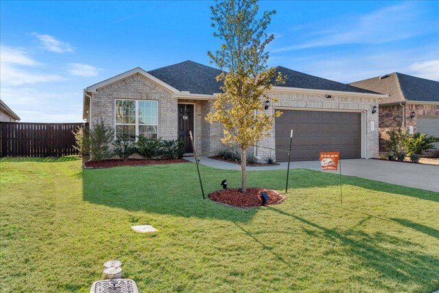 185 Slenderleaf Dr, Marble Falls, TX 78654 - ranch-style home with an attached garage, concrete driveway, brick siding, and roof with shingles