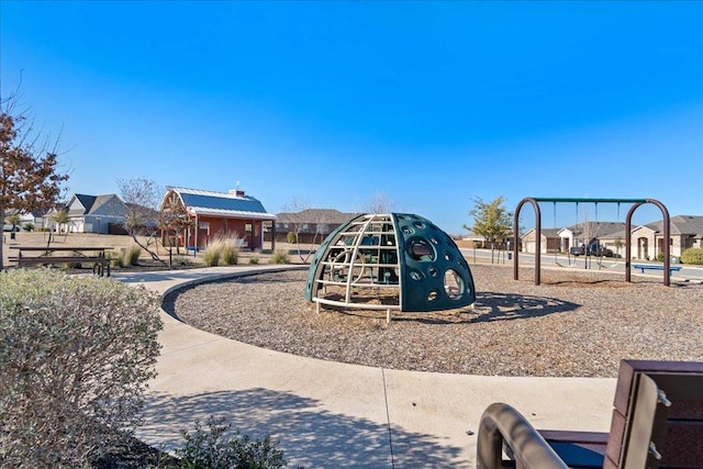 community jungle gym featuring a residential view