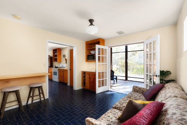 603 N Tumbleweed Trl, Austin, TX 78733 - living area with french doors and baseboards